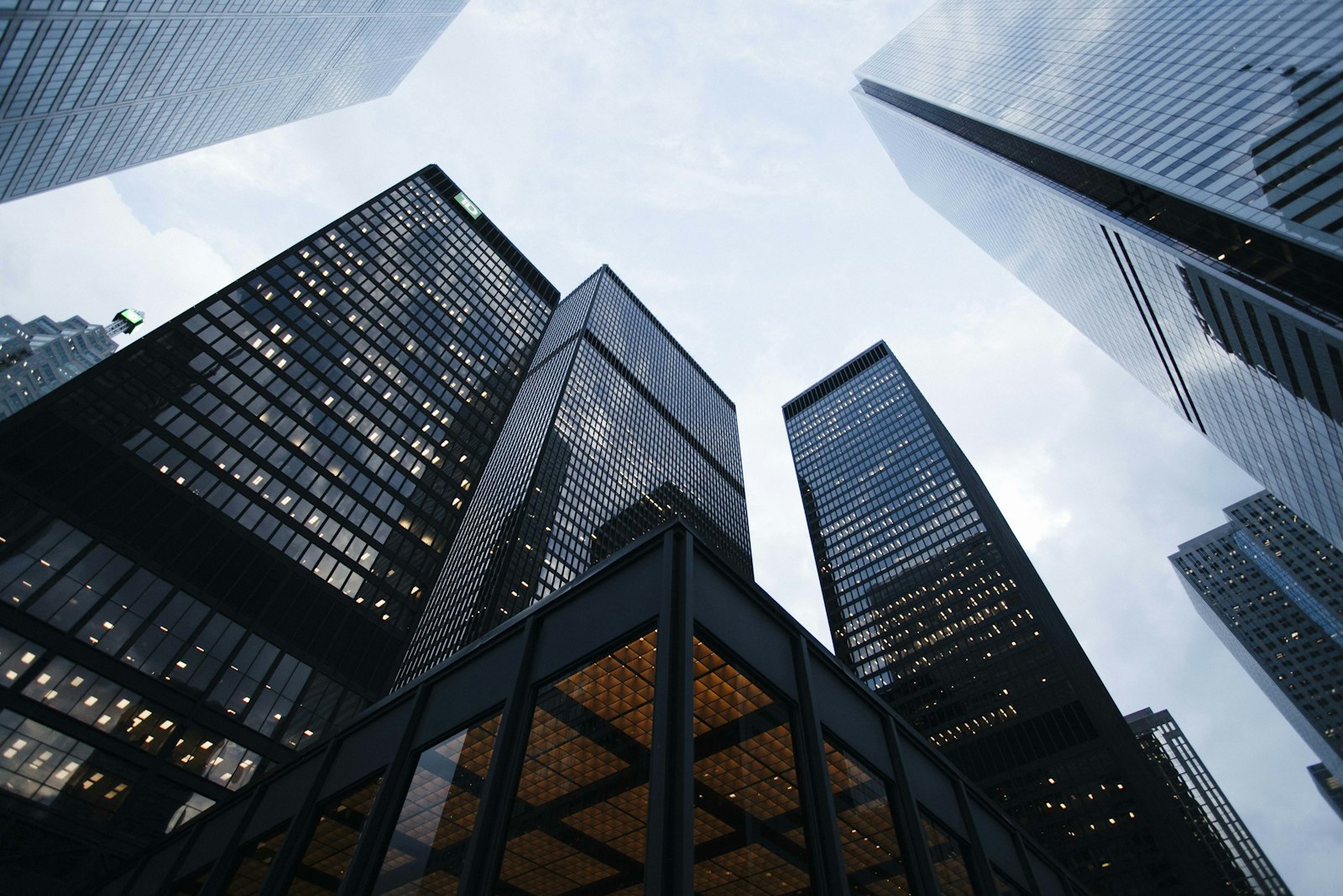 Modern glass commercial office tower representing Urban Refit Limited nationwide building maintenance projects